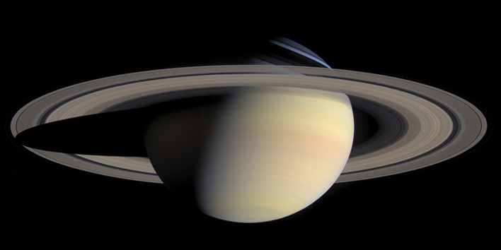 NASA photo of Saturn, glowing brilliantly against the black backdrop of outer space